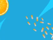 Image of Adderall pills and an orange