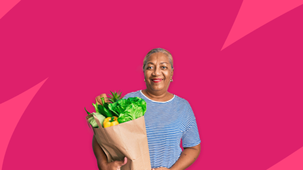 A woman holding a bag of groceries: 9 foods high in estrogen