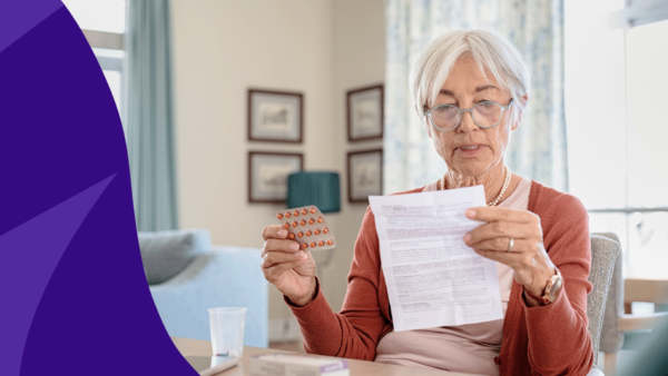 An older person reading medication instructions: Hydroxyzine side effects in elderly