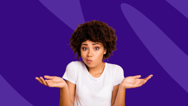 A wpman holding her hands up as if she's asking a question: What causes small dots on lips?