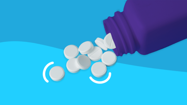 A pill bottle spilling out white tablets: Niacin flush: Causes, treatment, and prevention