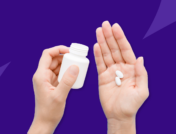 Hand holding Rx pill bottle and Rx pills: Can you take Tylenol with amoxicillin