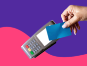 Someone's hand holding a card to a card reader: Farxiga copay card: Eligibility, savings & more