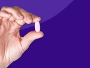 A hand holding a pill: How to save on Entresto