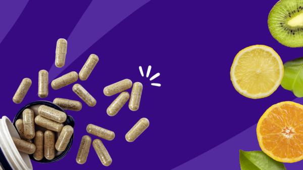 A bottle of supplements and citrus fruit | how much quercetin per day