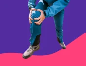 A woman holding her knee | Can stress cause gout?