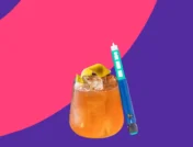 Cocktail next to a Zepbound injection pen - zepbound and alcohol