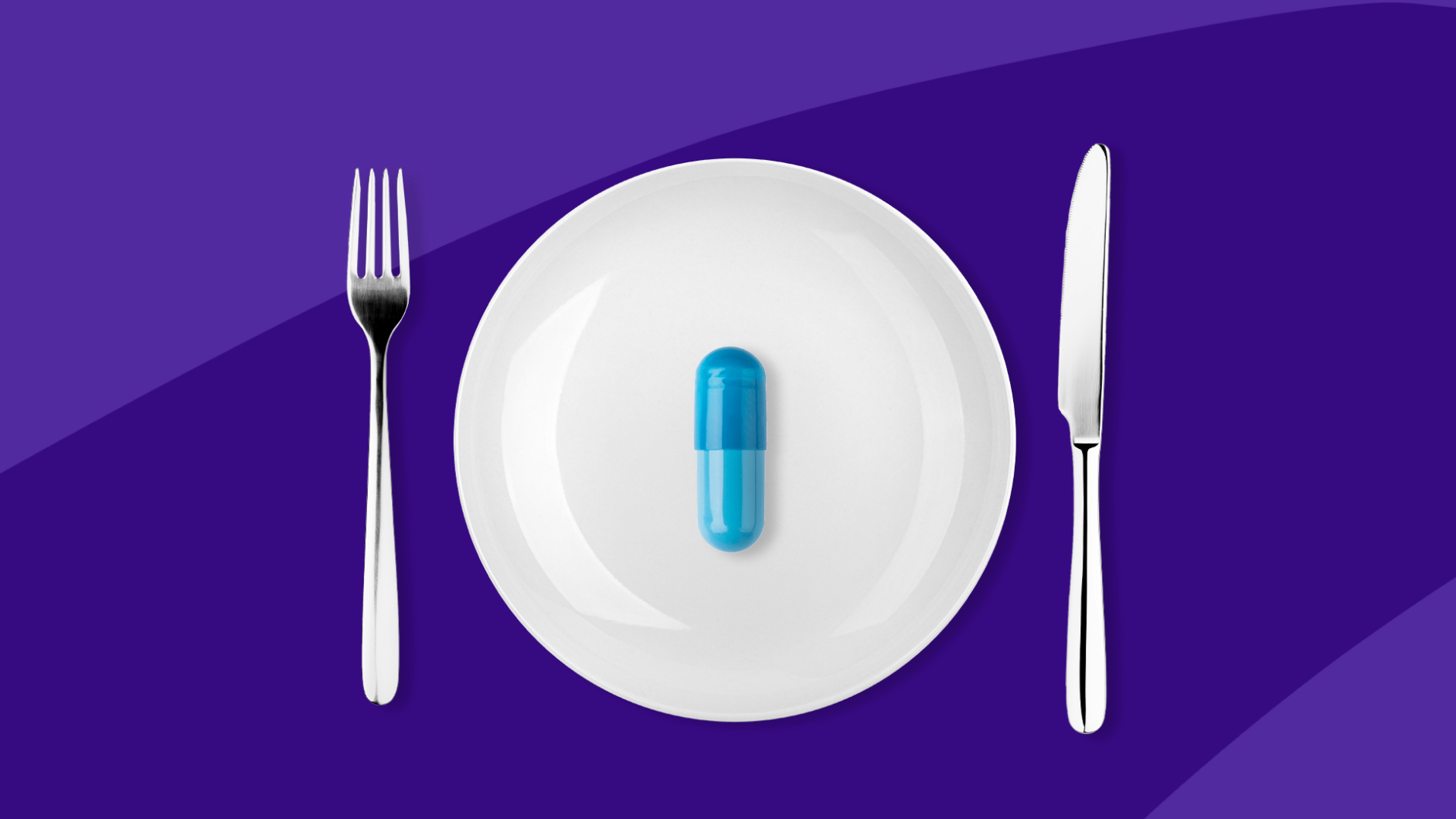 A fork and knife alongside a plate with a blue capsule on it: Phentermine diet plan: Tips for healthy weight loss