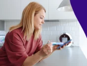Person holding an Ozempic pen - Can you take Ozempic with thyroid problem