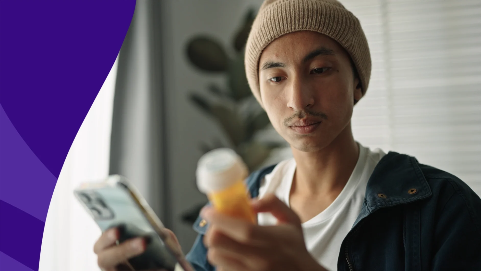 A man looks at his prescription bottle and his phone | Do muscle relaxers cause constipation?