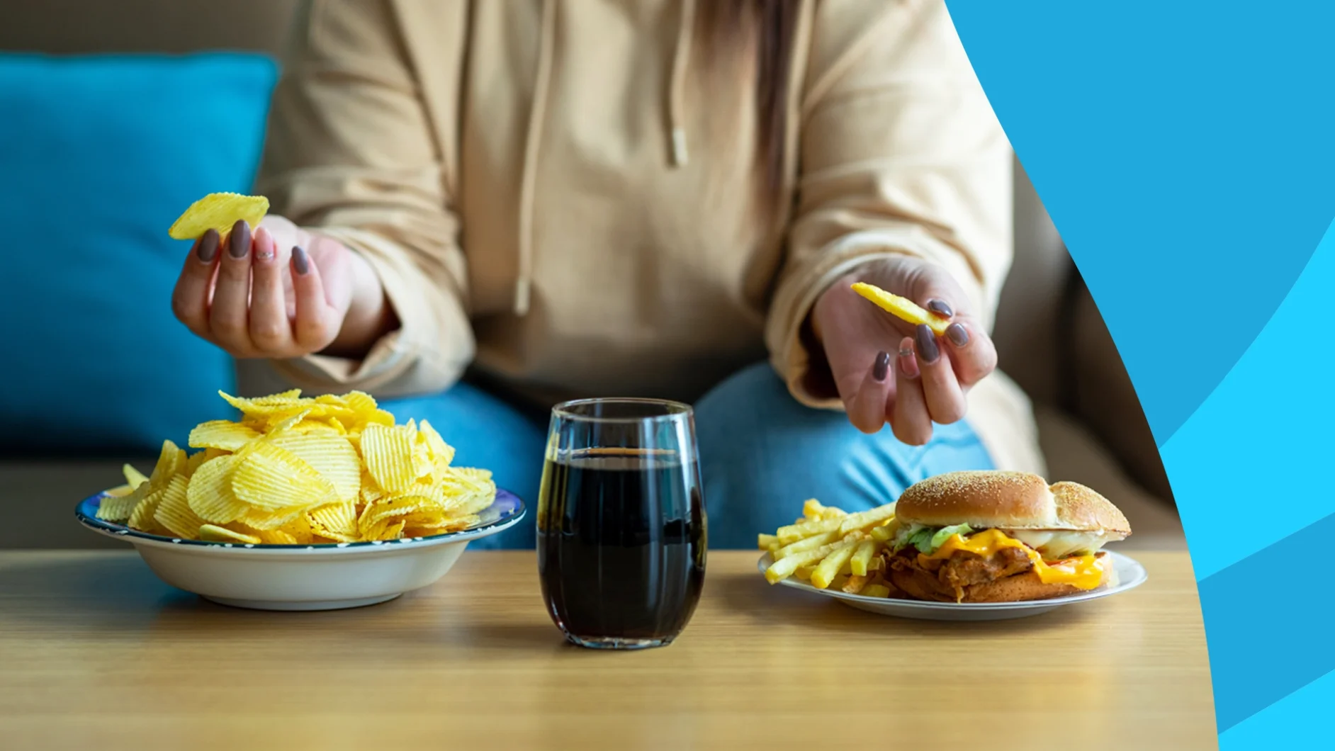 A person with chips, wine, and a burger in front of them | foods to avoid while taking Entresto