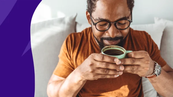 Man taking a sip of coffee - Can you drink coffee while taking Xarelto?