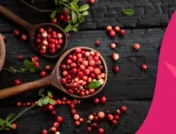Image of a scoop of cranberries - benefits of cranberries