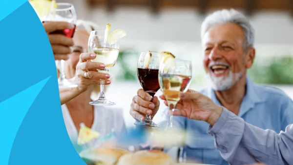 Group of people clinking glasses in a cheers - Jardiance and alcohol