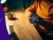 Person sitting at a table in the evening - can i take prednisone at night instead of morning