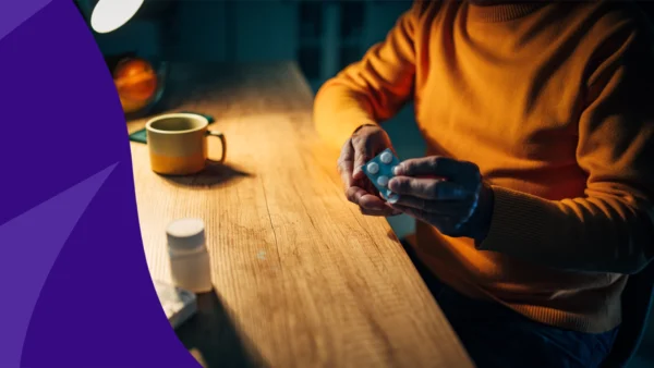 Person sitting at a table in the evening - can i take prednisone at night instead of morning