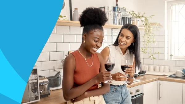Two women holding glasses of wine - doxycycline and alcohol