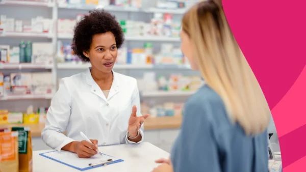 Pharmacist with a patient - help patients with CGM