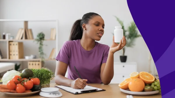 A woman looking at a pill bottle | Best time to take potassium