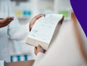 A pharmacist counseling a patient