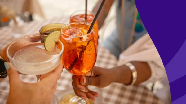 A group of people clinking glasses | clonazepam and alcohol