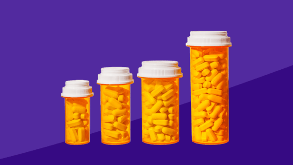 Four pill bottles of different sizes: Eliquis dose reduction