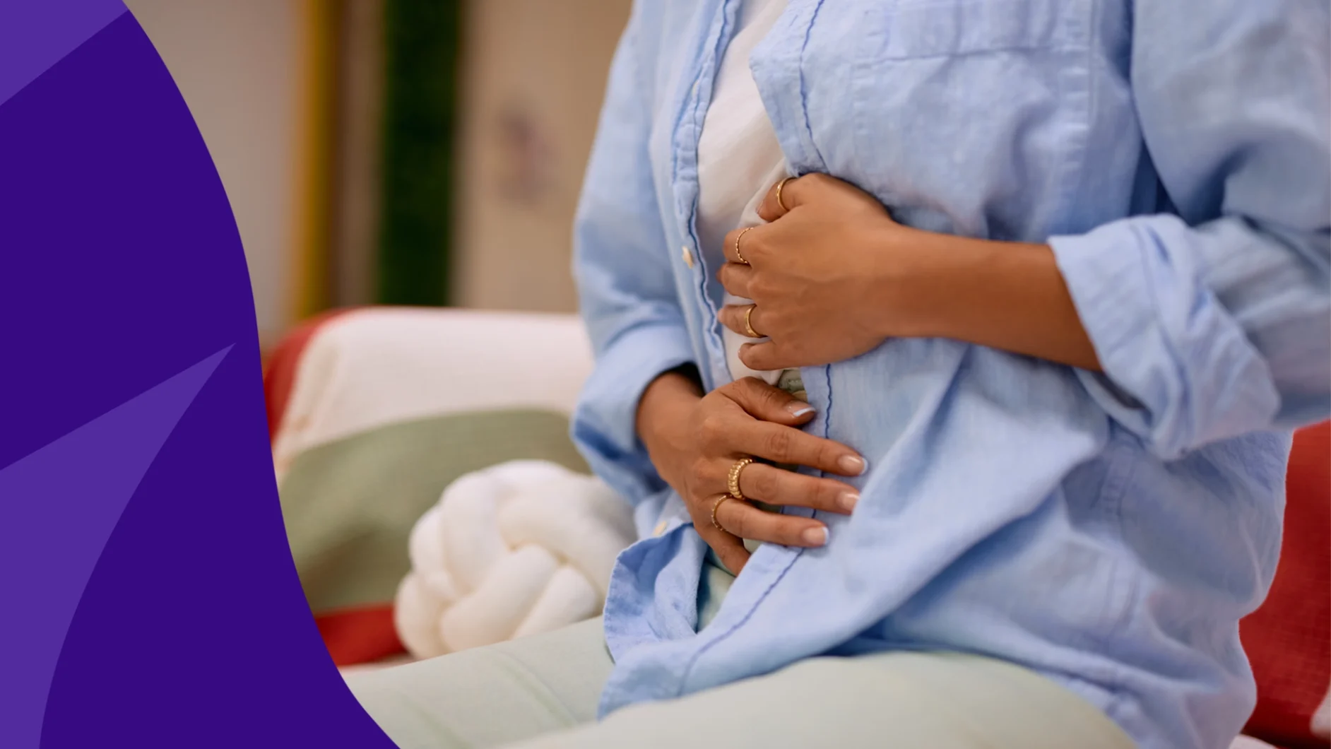 A woman holding her stomach | Zepbound diarrhea