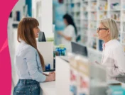 A pharmacist counseling a woman in perimenopause