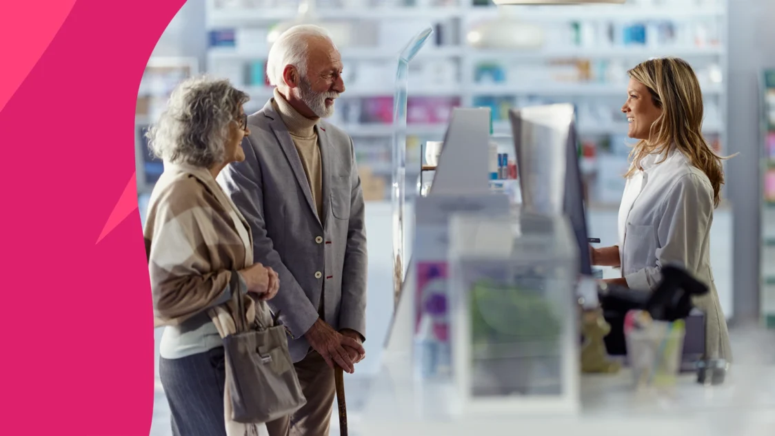 image of a pharmacist speaking to patients at the pharmacy counter - pharmacist’s role in supporting immune health