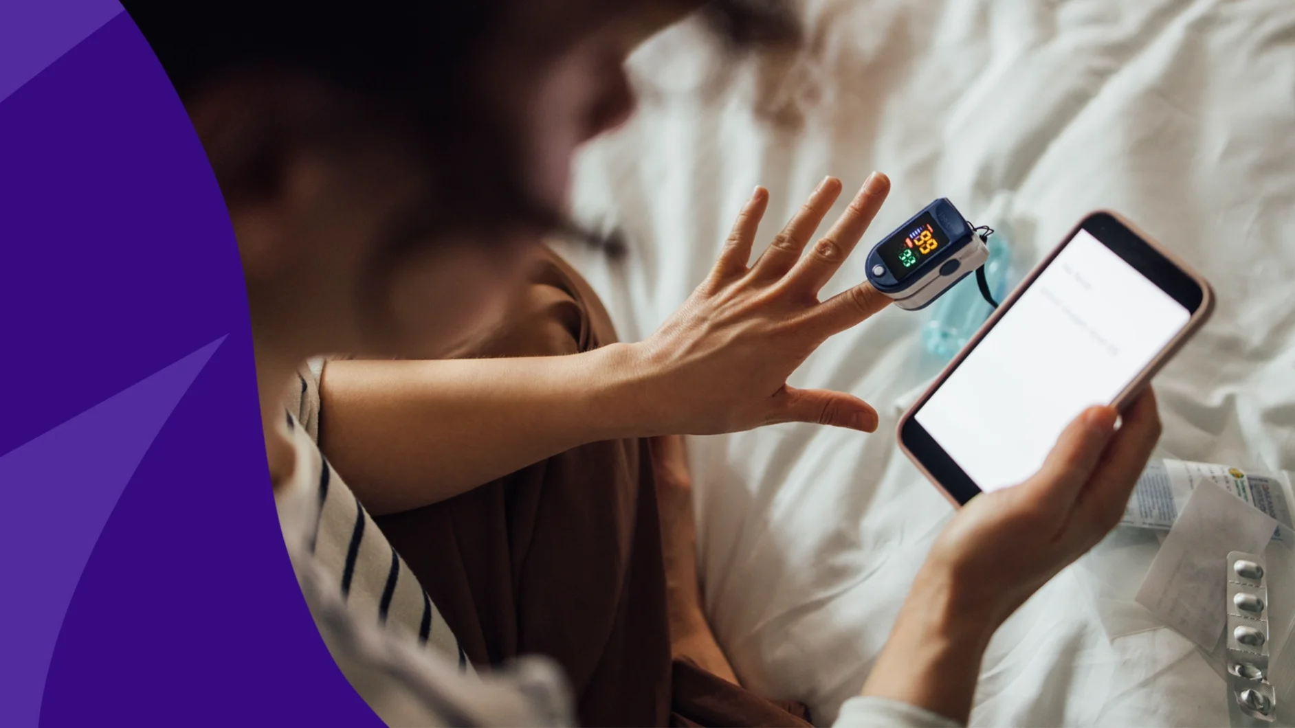 Image of a hand and screen - does lisinopril lower heart rate