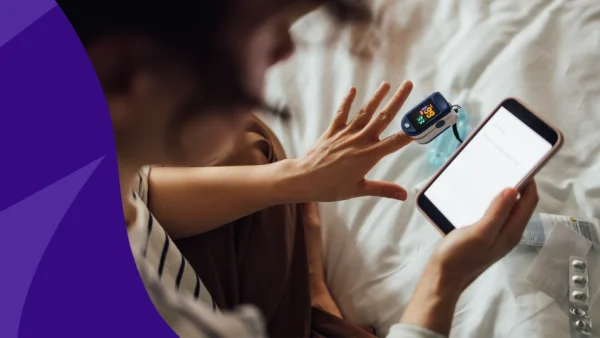 Image of a hand and screen - does lisinopril lower heart rate