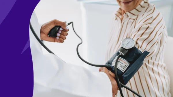 A person with a blood pressure cuff on | Can i take gabapentin with high blood pressure?