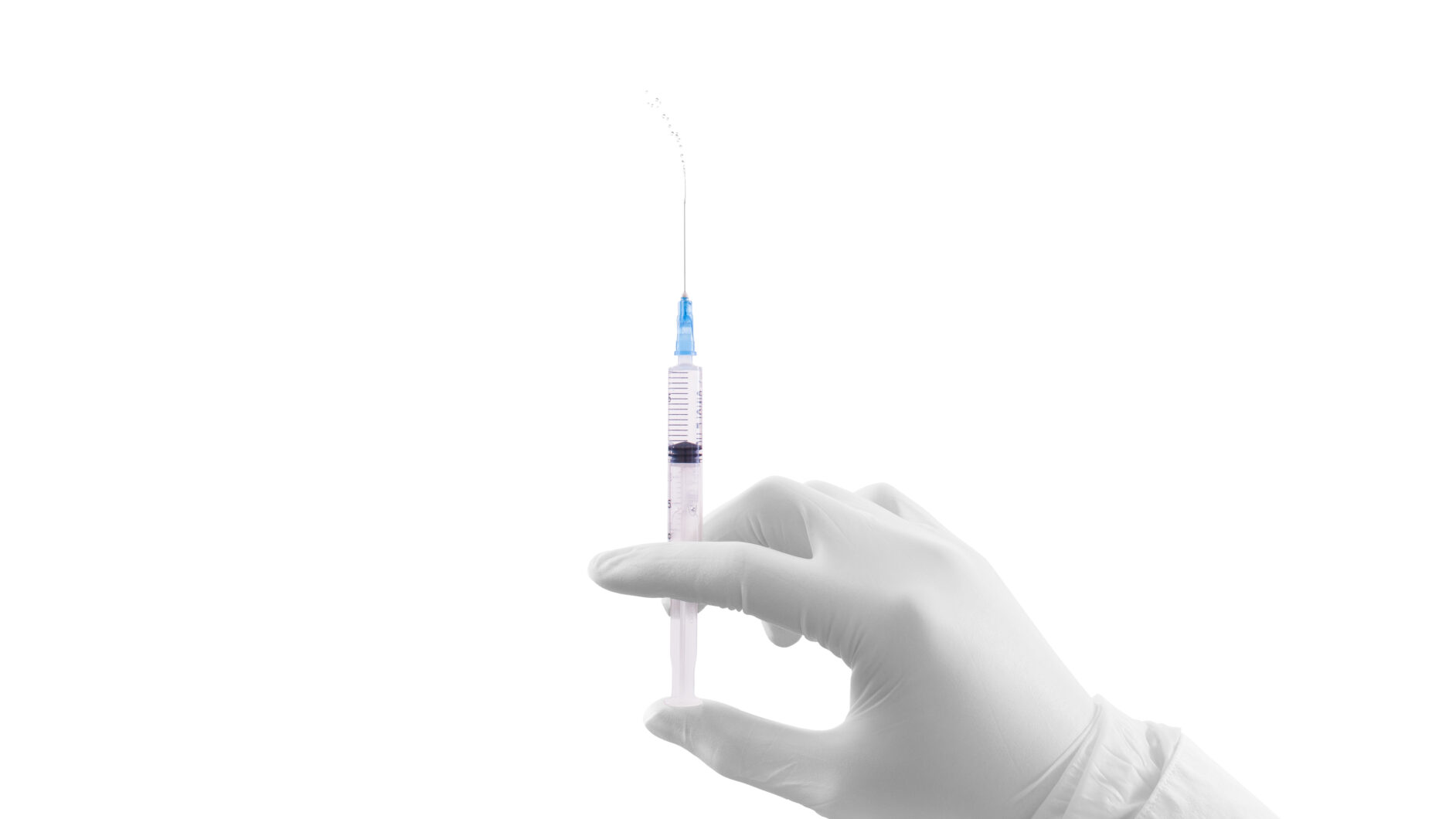 Hand holding syringe: Dupixent pen vs. syringe: How to choose the right option