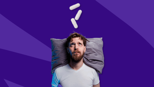 Man with his head on a pillow and Rx capsules over his head: If Adderall makes me sleepy, do I need a higher dose?