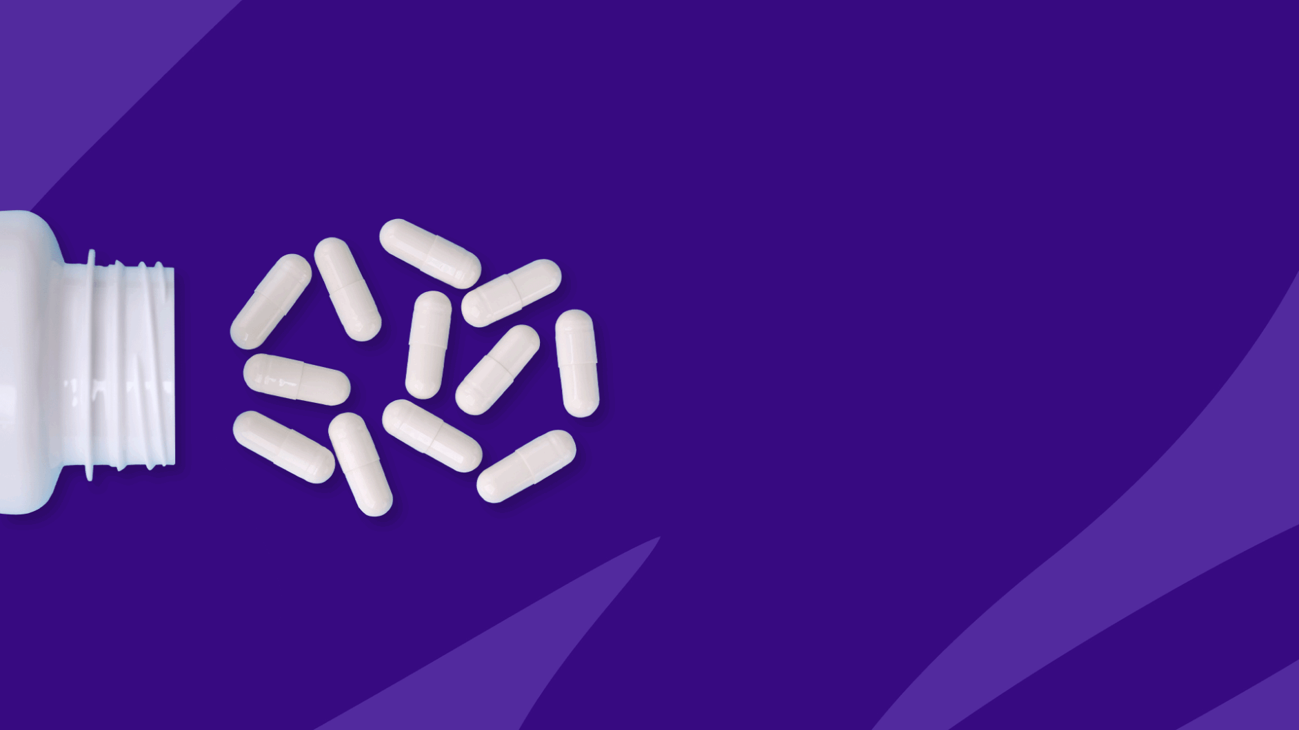 White capsules spilling out of a pill bottle: How much does Vraylar cost per month?