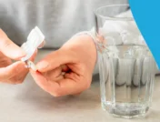 A person popping a pill out of a foil pack | Can Entresto be cut in half?