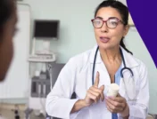 A doctor counseling a patient | Can you take propranolol as needed?