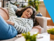 A woman napping on the couch | How long does clonidine make you sleepy?