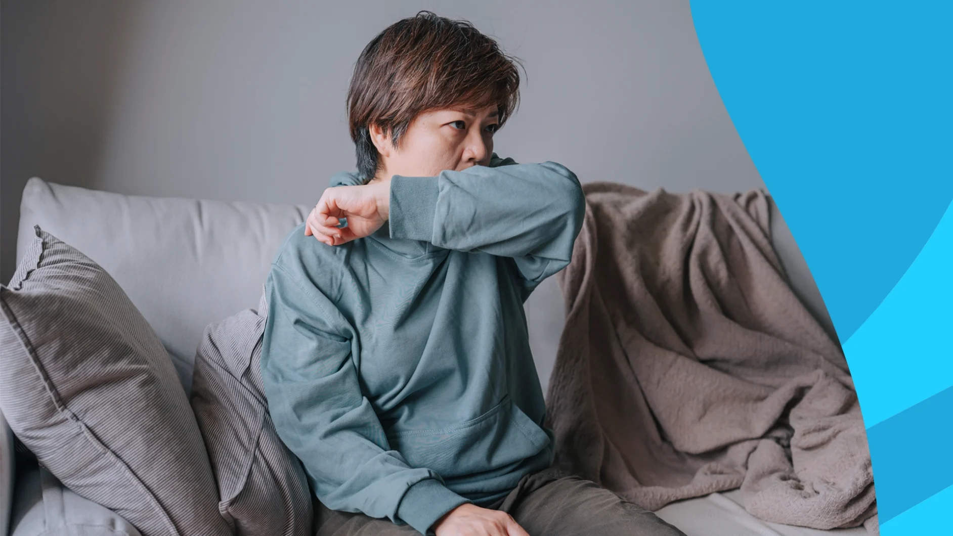 A woman covering a cough with her elbow | Does lisinopril cause a cough?