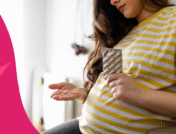 An expectant mom taking a pill | Can you take amoxicillin while pregnant?