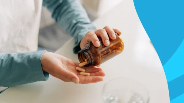 A man taking vitamins | Vitamins to avoid with diverticulitis