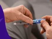 A person holding a GLP-1 pen | Can Mounjaro treat sleep apnea?