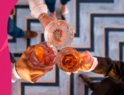 Image of people clinking cocktail glasses in a cheers - Bactrim and alcohol