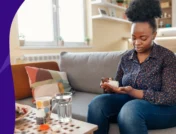 A woman taking a dose of metronidazole for diverticulitis