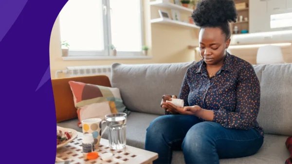 A woman taking a dose of metronidazole for diverticulitis