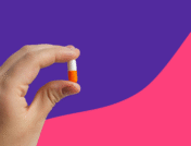 A hand holding an antibiotic capsule: Amoxicillin for strep throat