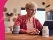 A woman drinking coffee with a pill bottle nearby | How long after taking ciprofloxacin can I drink coffee?