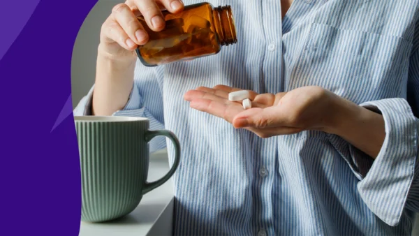 A woman taking a magnesium supplement | Side effects of too much magnesium