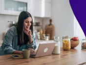 Woman using laptop in kitchen: How Americans use AI for medicine advice