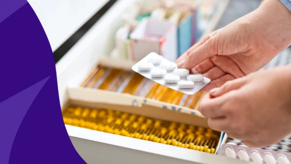 Image of a pharmacist's hands holding different types of tablets to represent oral GLP-1s